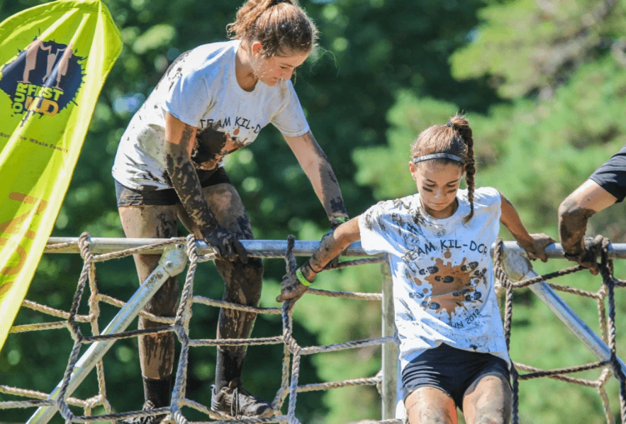 two girls climbing the steel stacks during the run