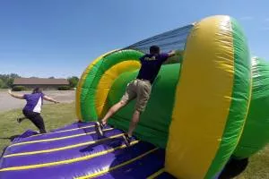 a person jumping on a jump house