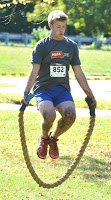 two kids and a woman during the mud run