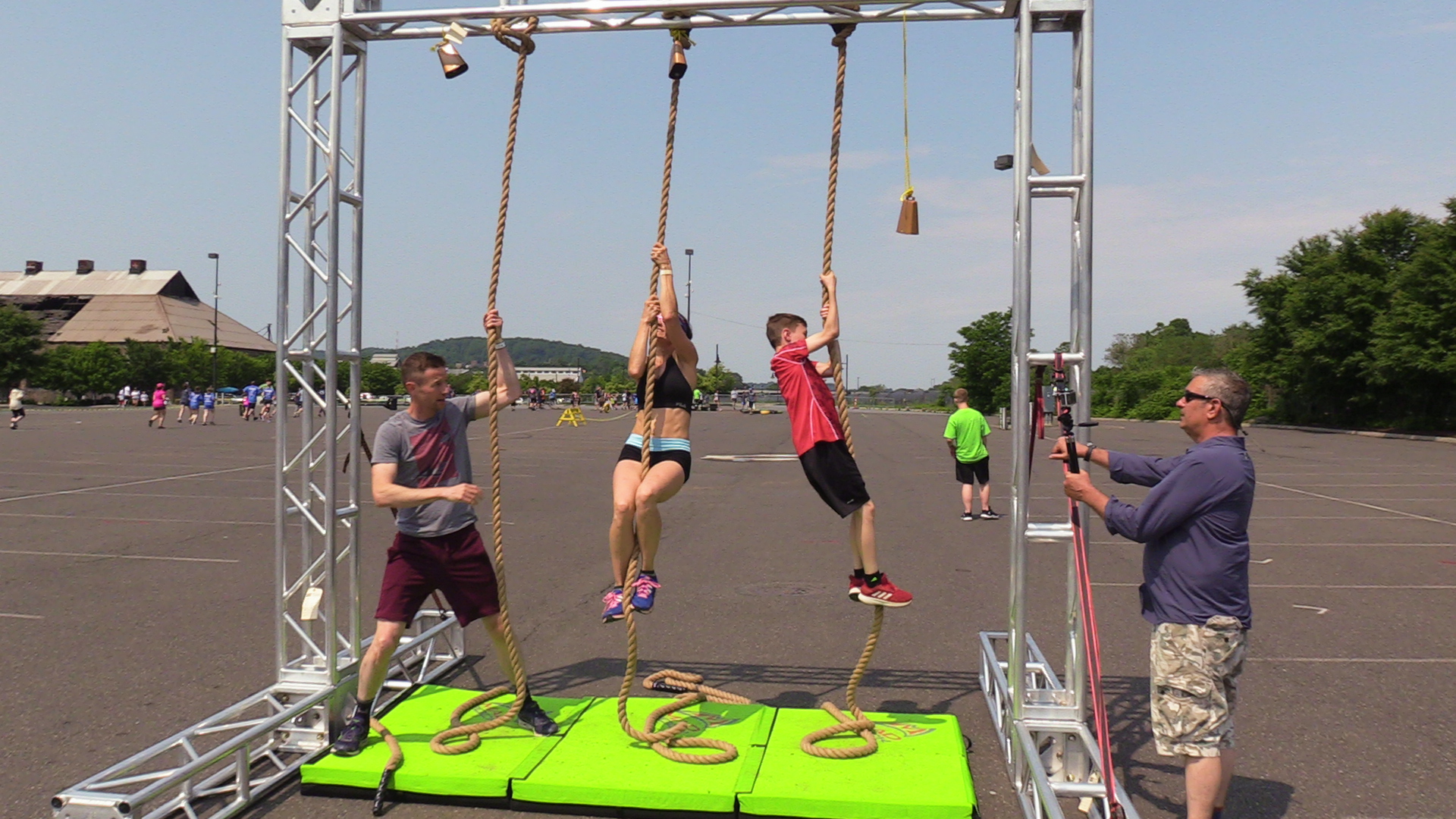 two kids and a woman during the mud run