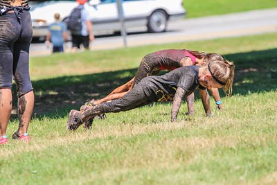 two kids and a woman during the mud run